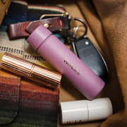 WeNatal For Her travel vial sticking inside a purse